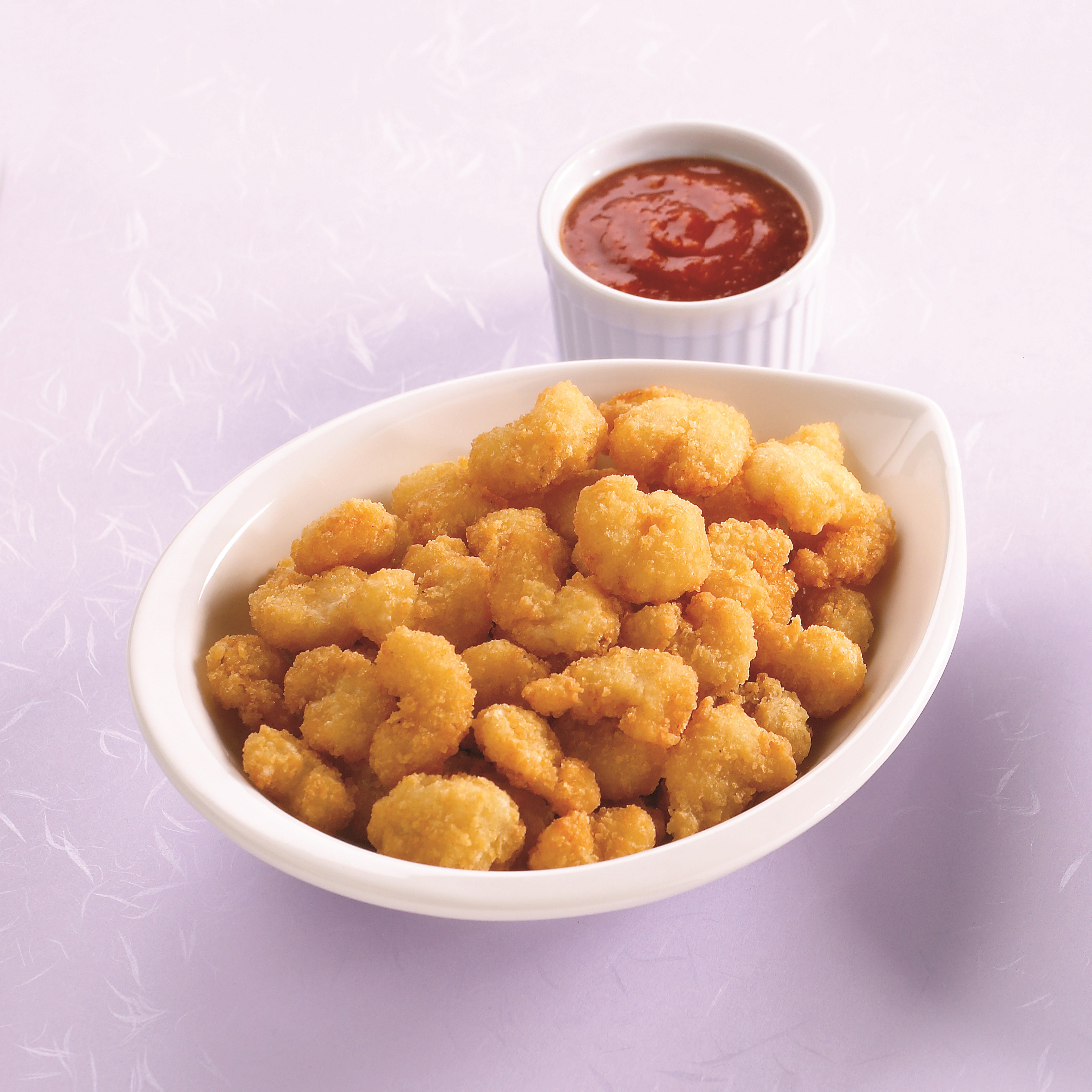 Raw Breaded Popcorn Style Shrimp Rounds Tail Off 2.5 Pound Each - 4 Per Case.