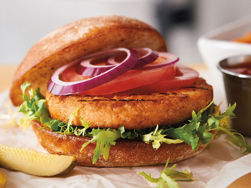 Trident Seafoods 4 Ounce Boneless Skinless Parfried Alaskan Salmon Burger 3 Pound Each - 12 Per Case.