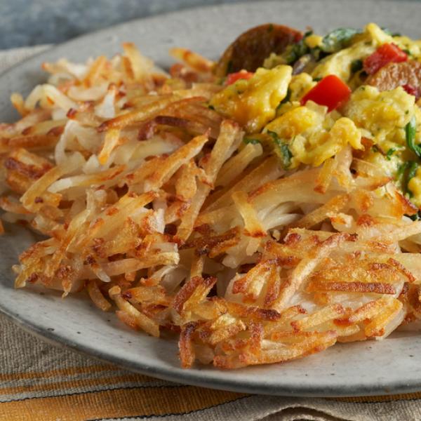 Shredded IQF Hash Browns Frozen Potatoes 3 Pound Each - 6 Per Case.